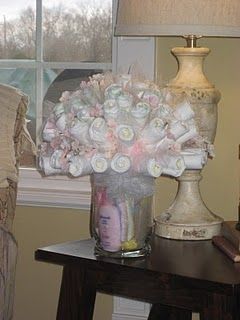Diaper bouquet! The new diaper cake – This is REALLY cute!!!  I would MUCH rathe