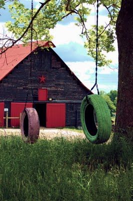 A barn and a couple of old tire swings.