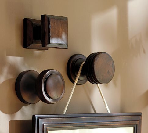 Beautiful way to hang your pictures, use decorative drawer pulls.