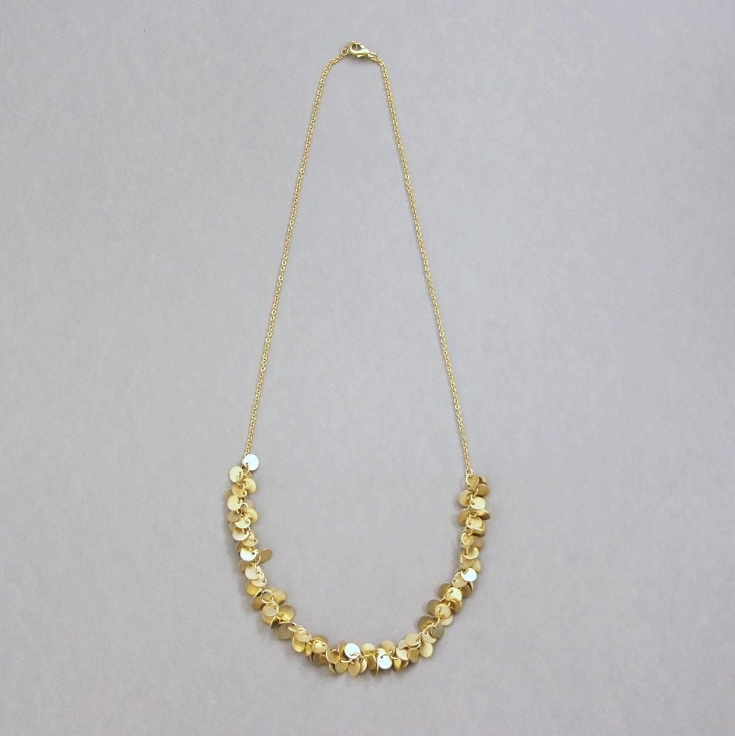 Confetti. Matte Finish Gold Plated Brass Necklace with Golden Discs. $28.00, via