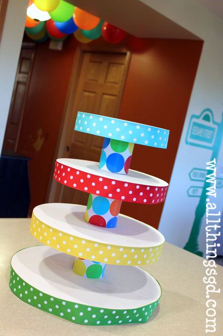 Cupcake Tower is made out of cardboard cake circles, soup cans, ribbon and wrapp