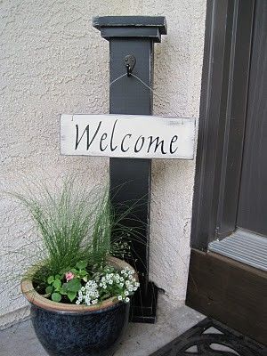 Cute idea- use a post and have different signs to hang for different times of ye