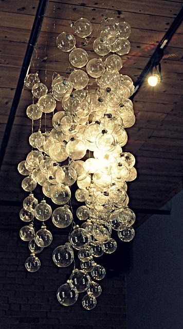 DIY "bubble" chandelier made from clear Christmas ornaments on string