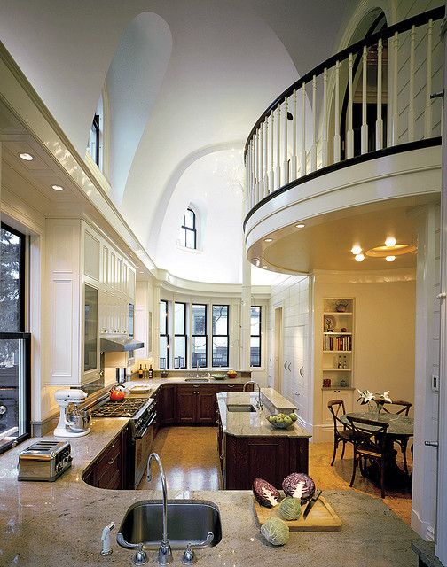 Double height ceiling balcony over kitchen