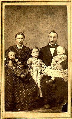Family photo….Father is holding deceased child.