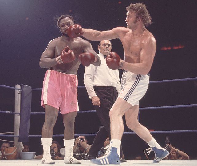 Joe Bugner nails Joe Frazier with a right hook during their 1973 fight at Earl&#