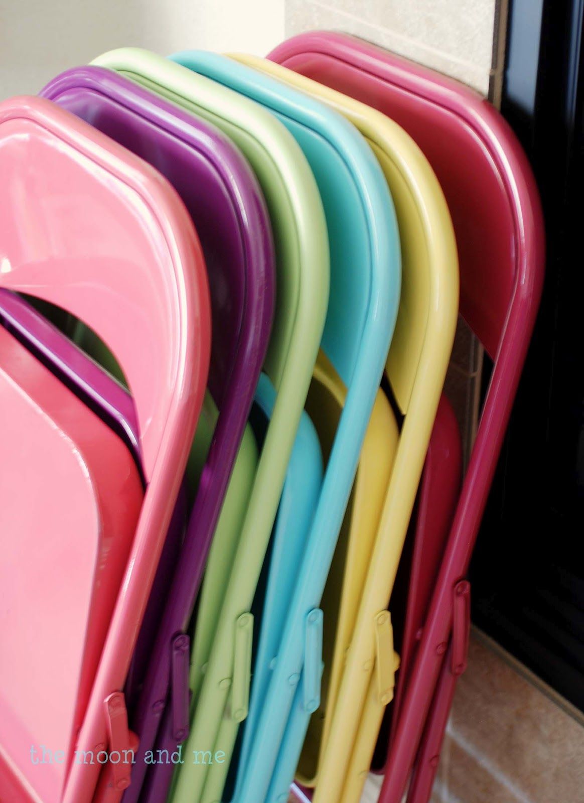 LOVE this idea!! spray paint your folding chairs….