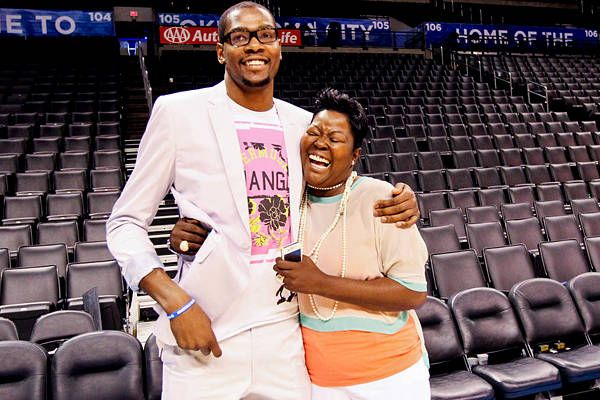 Mama's boy Kevin Durant gives his mother, Wanda Pratt, a kiss following ever