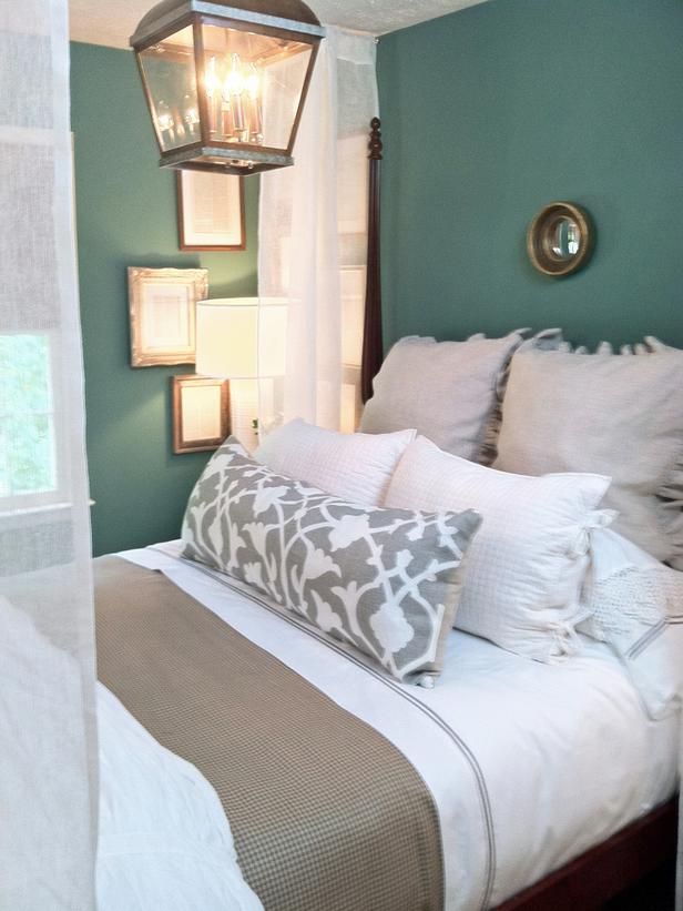 Neutral bedding tones and teal walls– love the wall color!!
