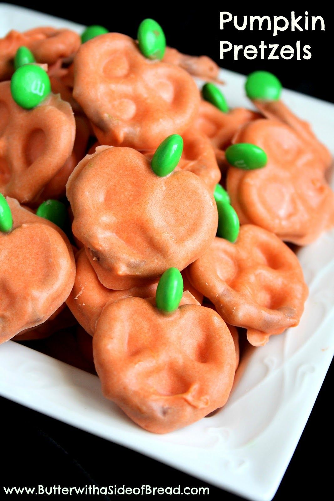 Pumpkin pretzels–use white choc. chips with orange food coloring and green M&#3