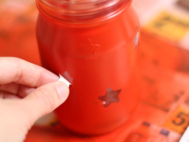 Spray paint over stickers on mason jars to create luminaries. Great idea for out