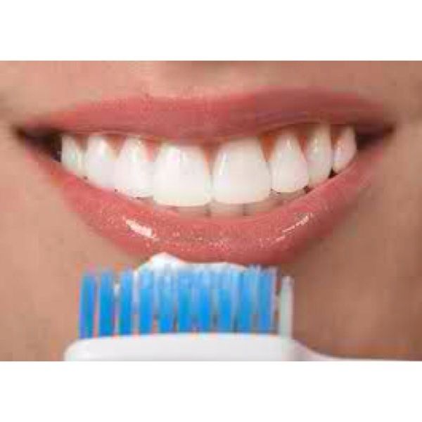 Take a q-tip dip it in a cap full of hydrogen peroxide and scrub on teeth leave