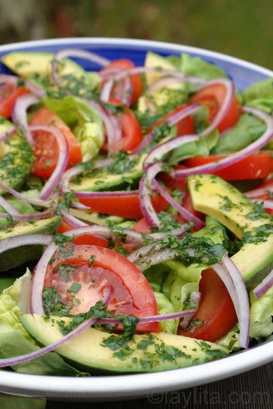 Tomato, avocado, lettuce and red onion salad with cilantro lime dressing