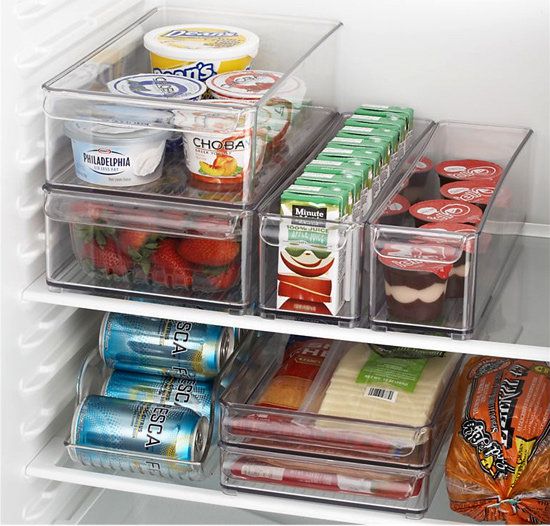 Use clear stackable bins to organize fridge.