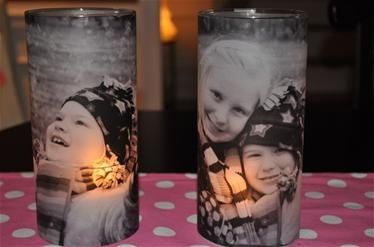 Vases found at Dollar Tree. Then you print the photos on vellum and mod podge th