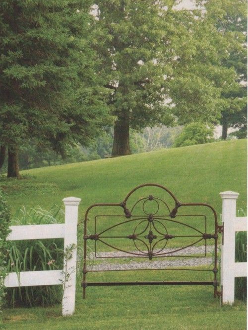 an old iron bed made into a gate!