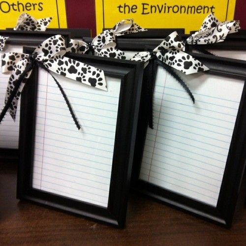 frame notebook paper, hot glue a bow, write with a dry erase marker … viola! P
