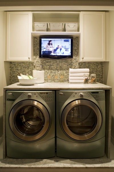now THIS is how you do a laundry room! tabletop for folding, simple cabinets to