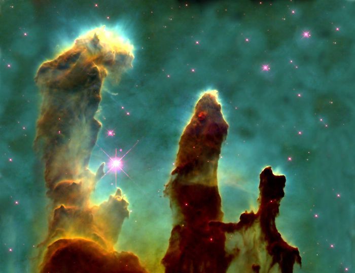 photograph taken by the Hubble Telescope of elephant trunks of interstellar gas