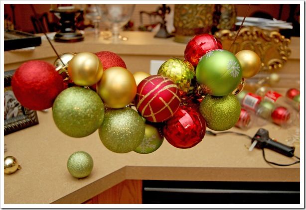 so that's how they do that… dollar store ornaments threaded onto wire hang