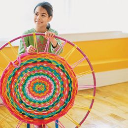 weave a small rug using old t-shirts and a hula hoop!
