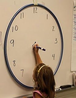 white board clock with hula hoop