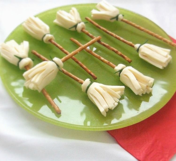 witch broom snack for halloween. made out of pretzel sticks and string cheese.