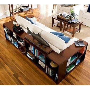 wrap the couch in bookcases instead of using end tables.