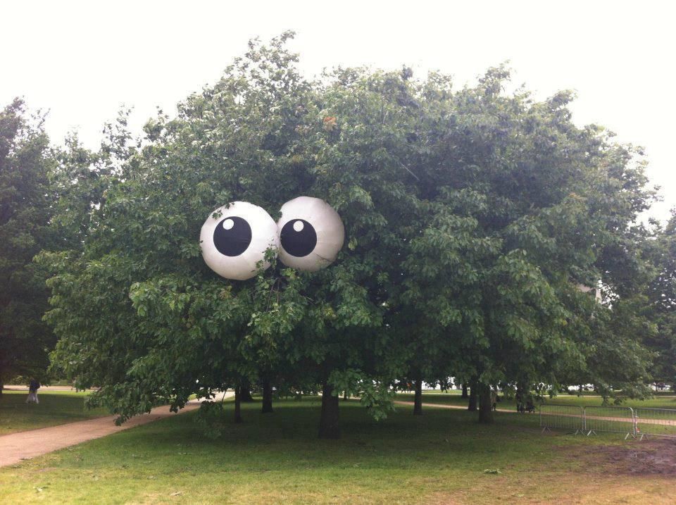 Beach balls painted to look like eyes put in a tree. Would be even spookier with