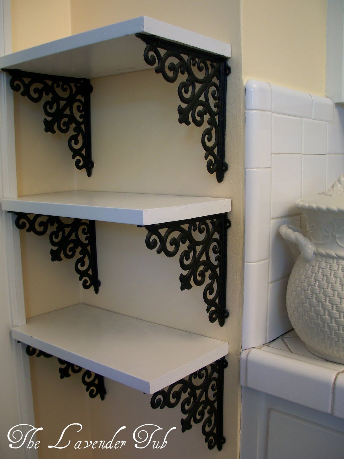 Brackets from hobby lobby and a piece of wood. DIY simple elegant shelves.