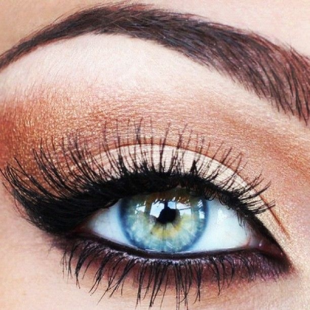 Copper & black eye makeup…blue eyes pop.
