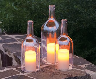 Cut the bottoms off wine bottles to use for candle covers, keeps the wind from b