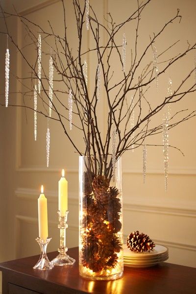 Fill glass containers with lights, pinecones & branches. Simple beauty!