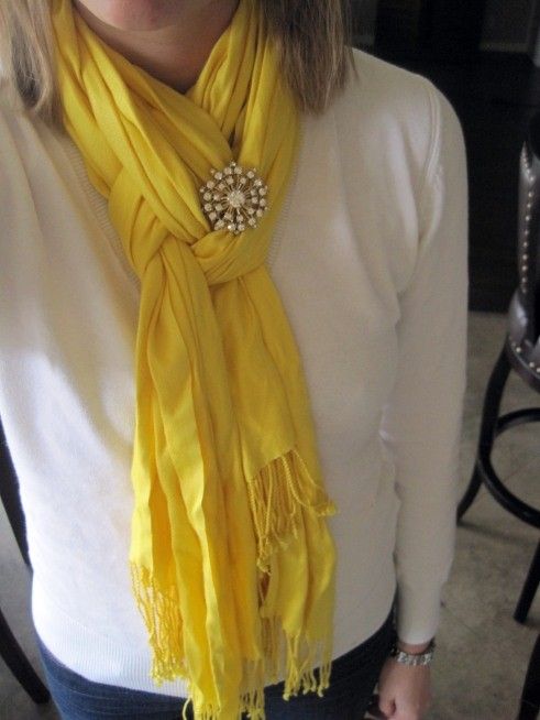 Fold scarf in half. Loop around neck. Pull only one strand of the scarf through