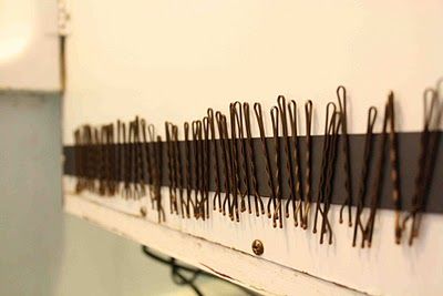 GENIUS. this is a magnet strip in the medicine cabinet for bobby pins to stick o