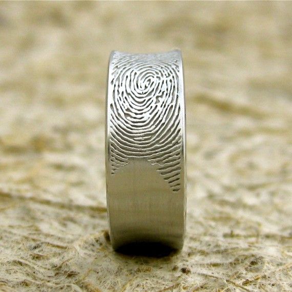 His wedding band with her fingerprint. This is just too cute!