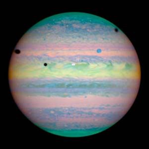 HubbleSite – Picture Album: Three Moons Cast Shadows on Jupiter