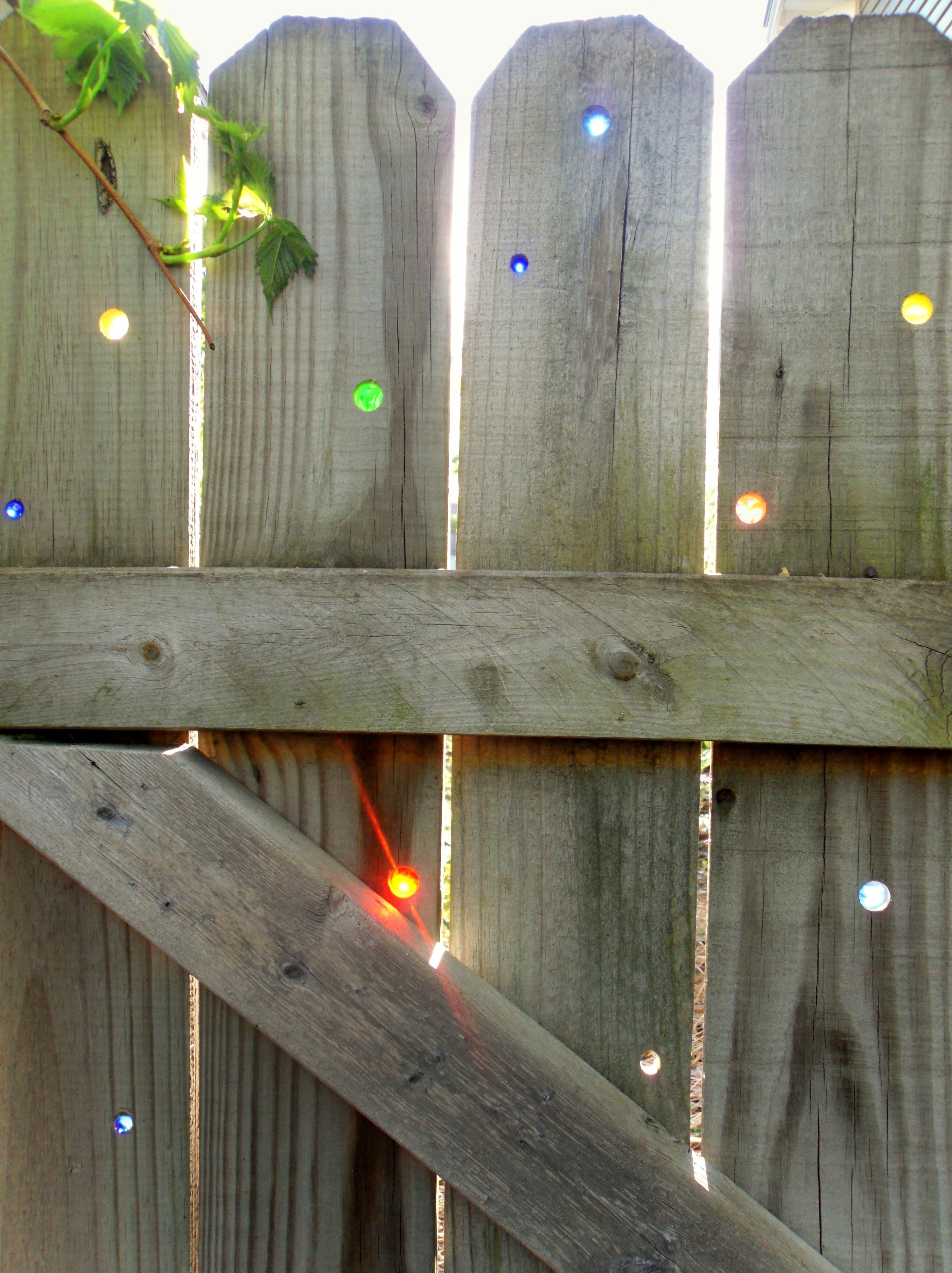 Marbles inserted in fence.
