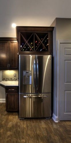 Take cabinet doors off above fridge and convert to wine storage. Great idea!!!