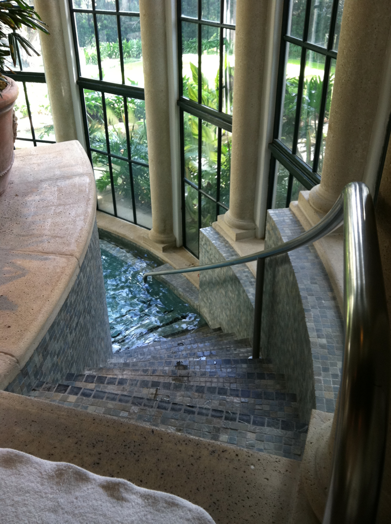 The steps down to an indoor pool.