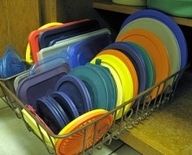 Use a dish drainer to organize pot lids, or Tupperware lids in a cabinet.  You c