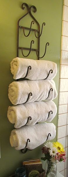 Use a wine rack as a towel holder in the bathroom. Love this idea!  Now to find