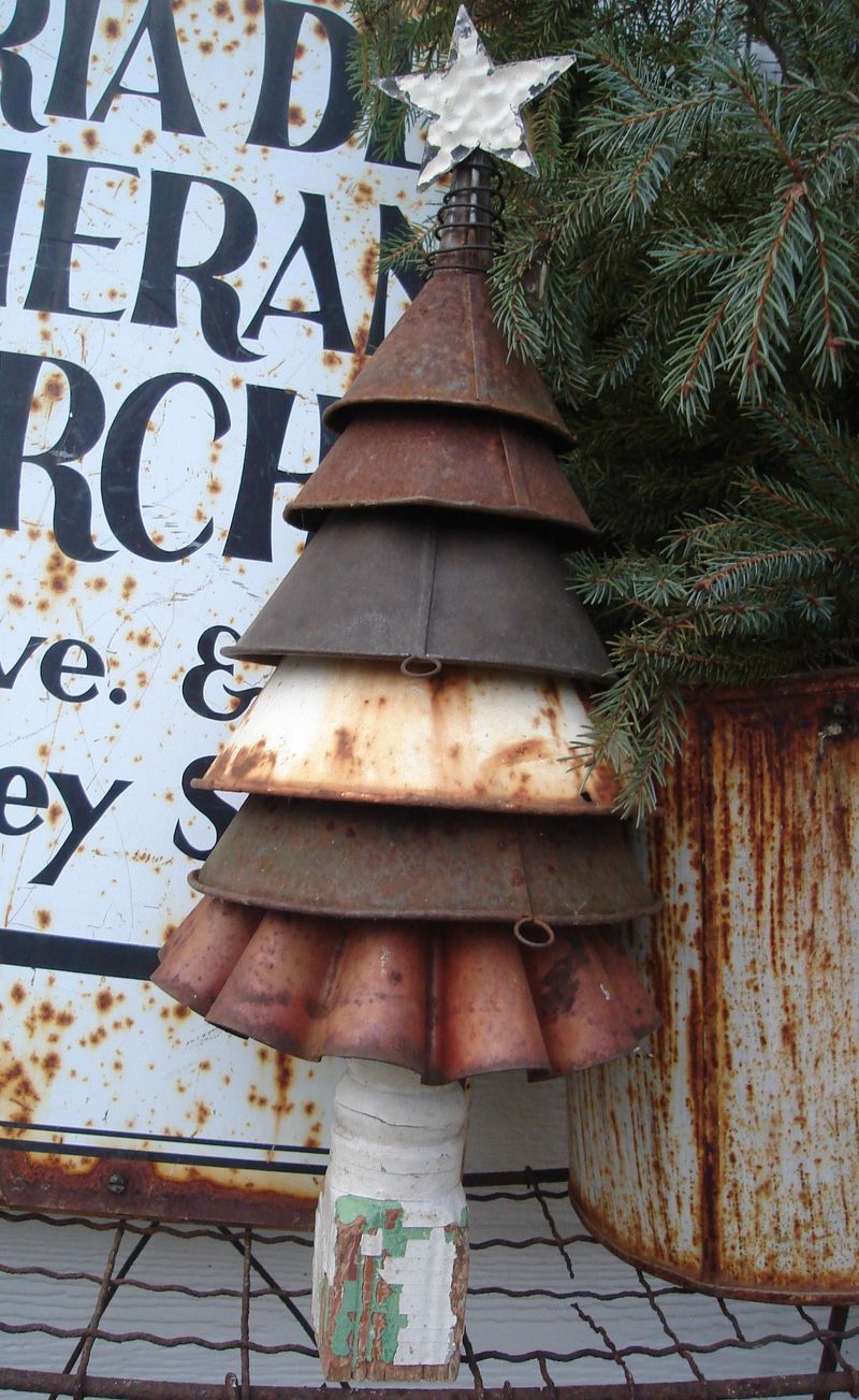 Use old rusty funnels to make a great rustic Christmas tree. You can also paint