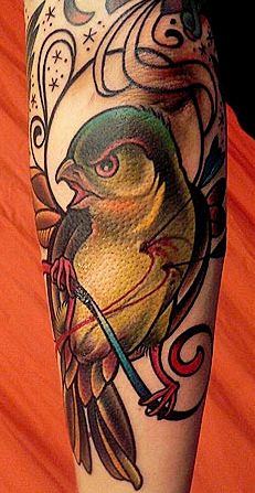 bird tattoo. Love the colors.