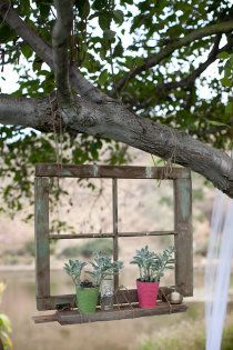 old window hanging from tree in the yard……LOVE this!