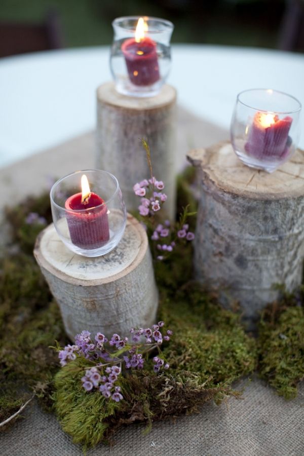 simple candles on wooden pillars