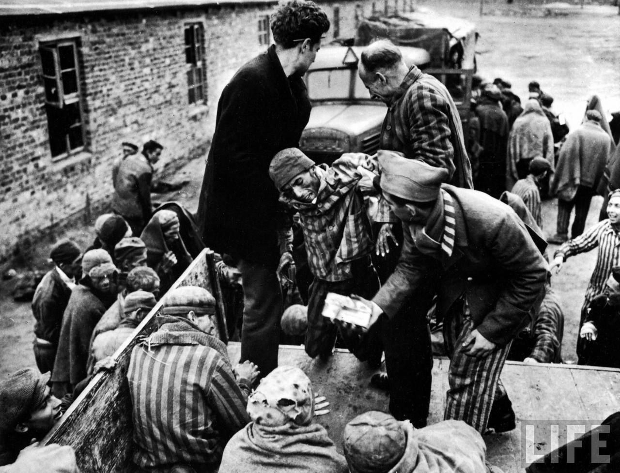 American soldiers liberating prisoners from a concentration camp at the end of W