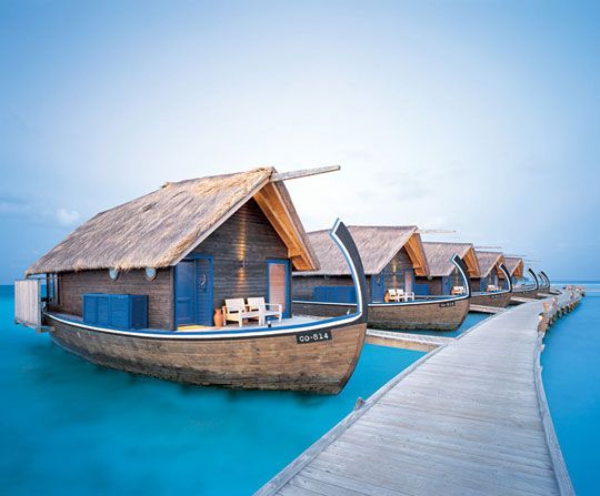 Cocoa Island's 23-room hotel with suites resembling local dhoni fishing boat