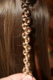 Do a normal braid, then hold onto the middle strand and push the 2 sides up the