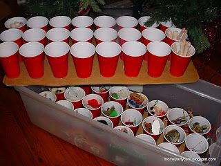 Hot glue cups to cardboard and store Christmas ornaments in them in tubs….